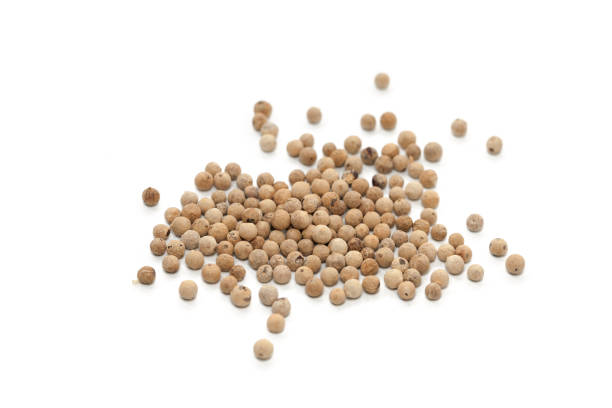 istock Pile of white pepper isolated on white background 904602222