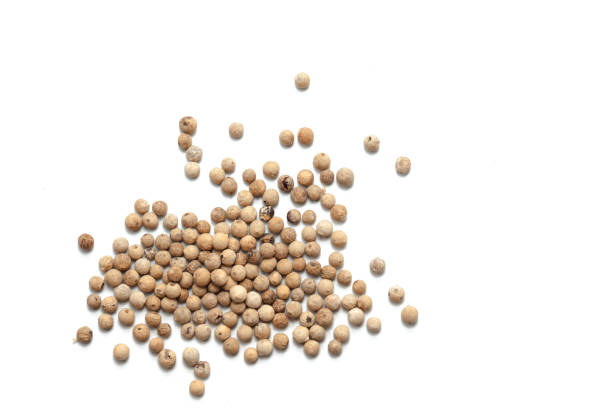 istock Pile of white pepper isolated on white background 904602308
