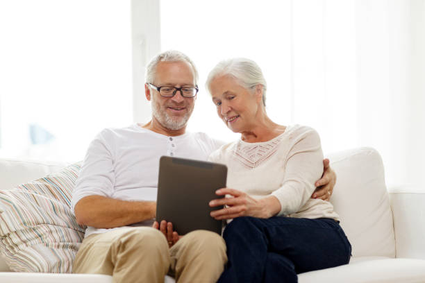 istock happy senior couple with tablet pc at home 904603772
