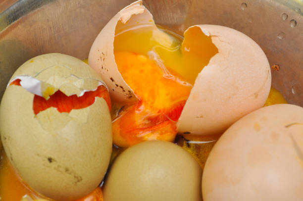 Rotten eggs in bowl. Bad eggs are not for eating and they have terrible smell decay stock pictures, royalty-free photos & images