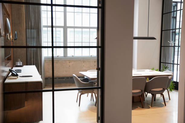 istock Empty boardroom at a business seen through open door 904608160