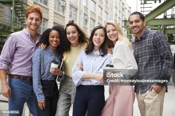 Six Young Adult Coworkers Standing Outdoors Group Portrait Stock Photo - Download Image Now