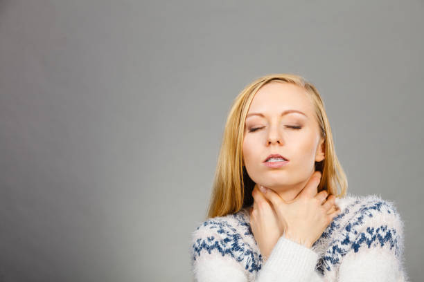 istock Woman having sore throat feeling pain 904611004