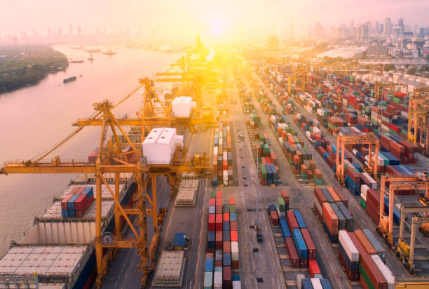istock container,container ship in import export and business logistic,By crane,Trade Port , Shipping,cargo to harbor.Aerial view,Water transport,International,Shell Marine,transportation,logistic,trade,port 904615170