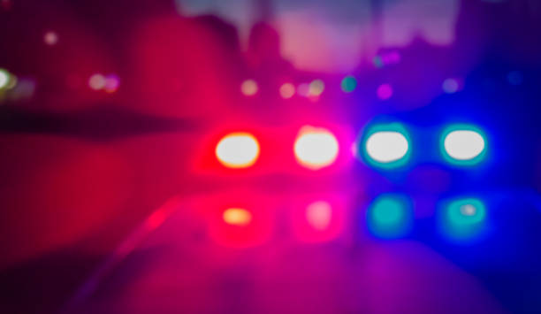 Lights of police car in night time. Night patrolling the city, lights flashing. Abstract blurry image. Lights of police car in night time. Night patrolling the city, lights flashing. Abstract blurry image. police and firemen stock pictures, royalty-free photos & images