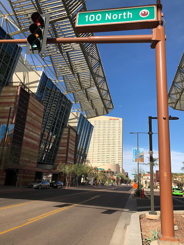 PHOENIX, AZ - DECEMBER 11, 2017: Traffic light and street sign next to Phoenix Convention Center North Building