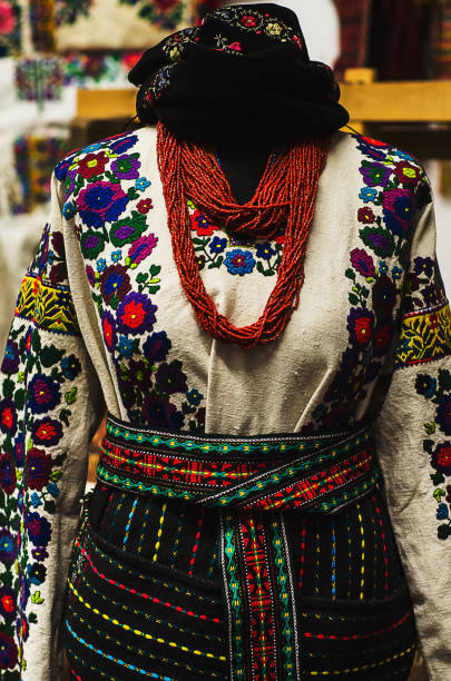 istock Traditional ukrainian costume, retro ethnic clothes with embroidered ornament and pattern with string of beads from corals with silver coins 904635082