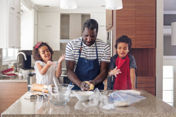 istock Father cooking with kids 904639234