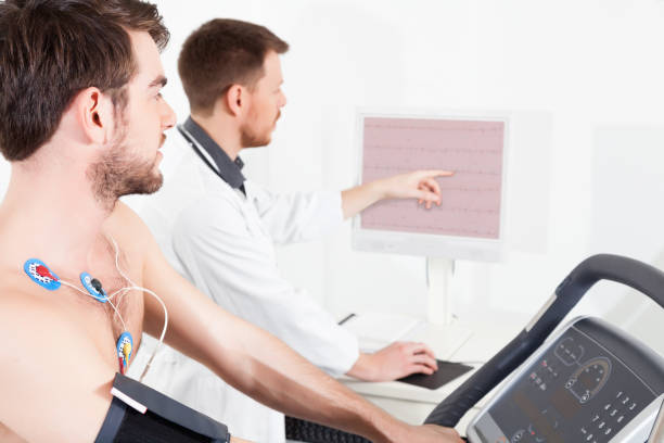 cardiac stress test ECG Tracings Doctor shows the patient the ECG recording of the electrical activity of the heart stress test stock pictures, royalty-free photos & images