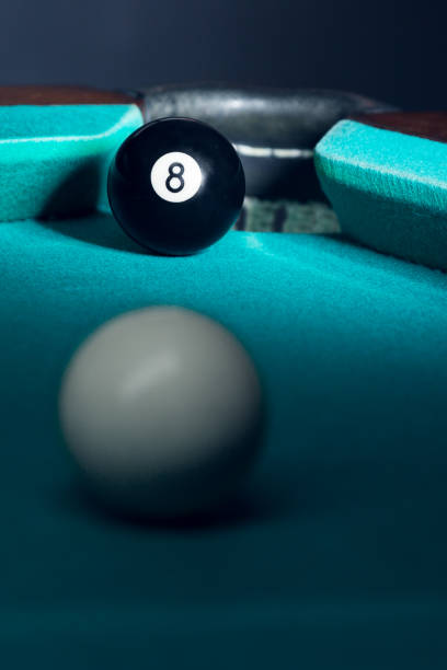 istock Billiard balls in a green pool table 904647378