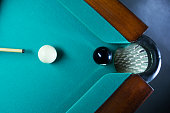 Billiard ball in a green pool table