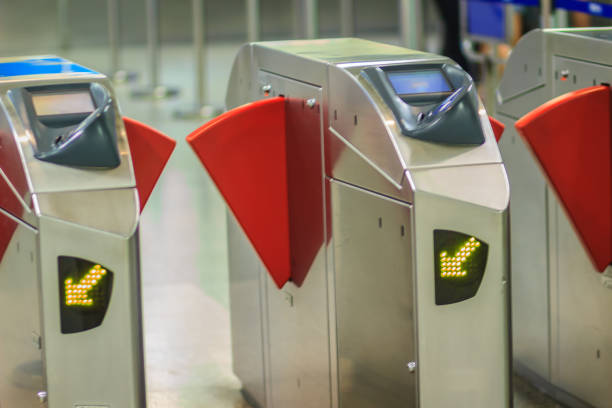 istock Automatic access control ticket barriers in subway station. View of barrier gate before access in to subway station. Automatic ticket barriers at subway entrance. 904655354