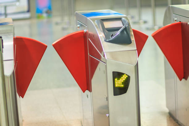 istock Automatic access control ticket barriers in subway station. View of barrier gate before access in to subway station. Automatic ticket barriers at subway entrance. 904655396