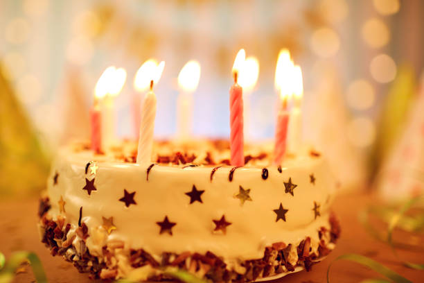 A close view of birthday cake with a candle on the table.