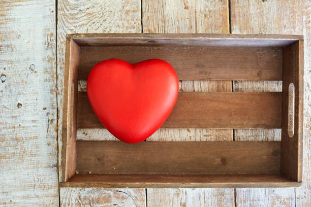 istock Red heart in a wooden box on the table 904658648