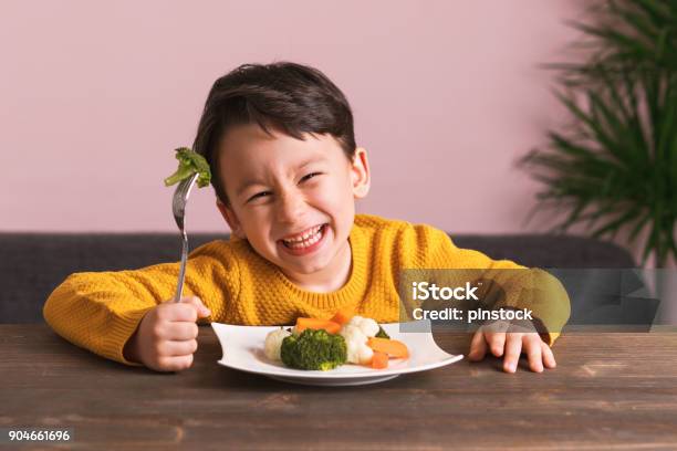 Child Is Eating Vegetables Stock Photo - Download Image Now - Child, Eating, Healthy Eating