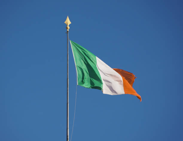 istock Irish Flag of Ireland over blue sky 904665196