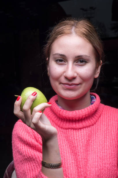 istock Woman with green apple 904666808