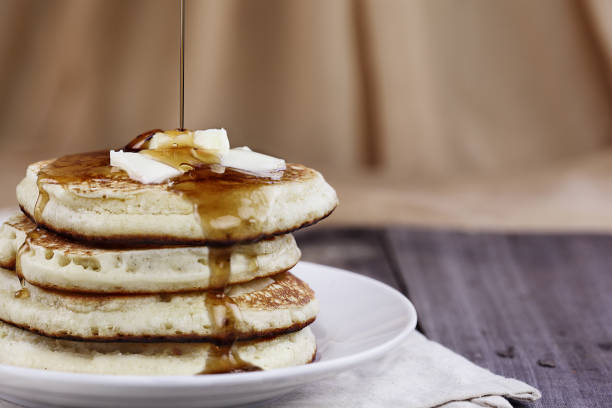 istock Pancakes and Syrup Being Poured 904672610