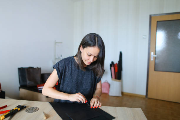 istock young designer making women bags for sale 904682680