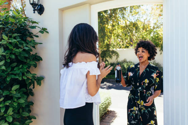 excited woman with wine bottle for housewarming party - new greetings imagens e fotografias de stock