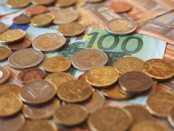 istock Euro notes and coins, European Union 904687312