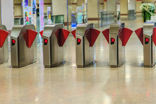 istock Automatic access control ticket barriers in subway station. View of barrier gate before access in to subway station. Automatic ticket barriers at subway entrance. 904687712