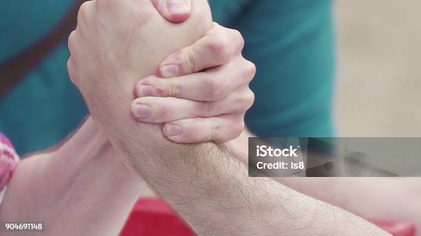 Two Unrecognizable Men Arm Wrestling Concept Of Struggle Confrontation And Heavy Sport Conflict Win And Loss Winning And Losing Competition In Power Struggle With Hands Force Energy And Will To Win Intense Struggle Of Armwrestling Competition Stock Photo - Download Image Now