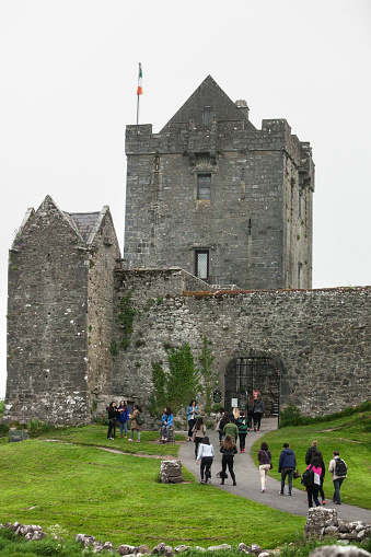 County Galway, Ireland - May 29, 2016. Tourists at Dunguaire Castle on Galway Bay in County Galway, Ireland.