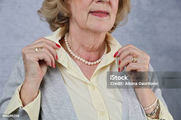 Stylish Elderly Woman Getting Ready To Go Out Active Senior Lifestyle Close Up Of Old Female Manicured Hands Jewellery Fashion Details Stock Photo - Download Image Now