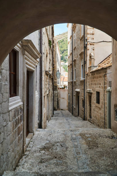 istock a medieval cobbled street in the town 904698696