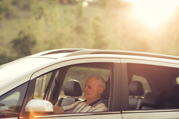 istock Senior man driving car 904698824