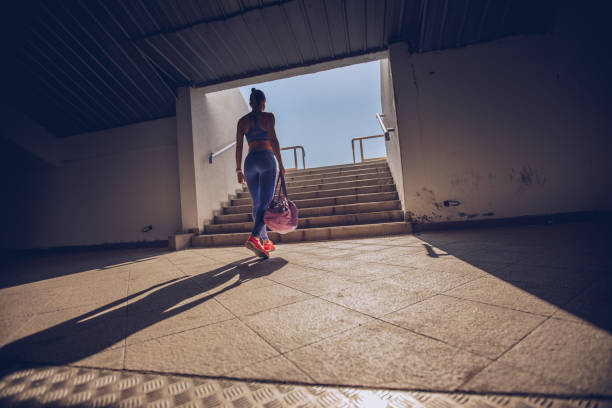 istock Woman athlete on stadium entrance 904704032