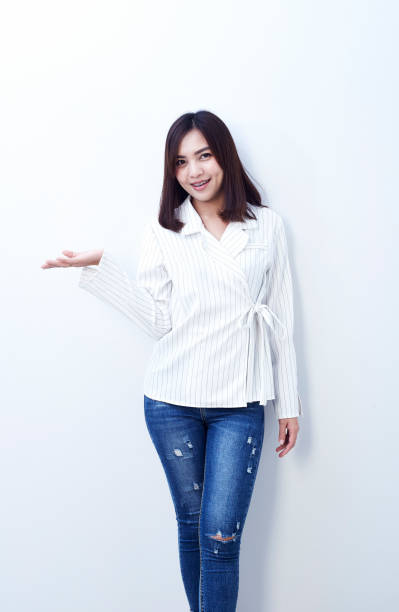 istock Beautiful girl in jeans on a white background 904727404