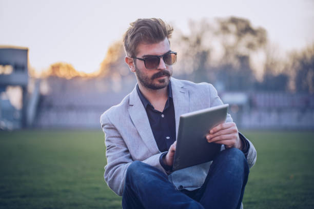 istock Soccer manager sitting on a field 904727458