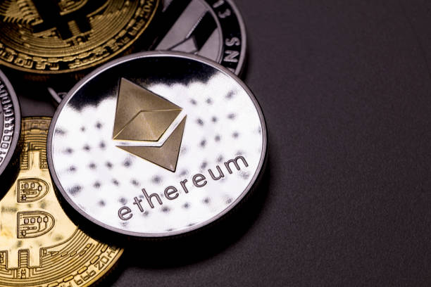 cryptocurrency: ethereum izmir, Turkey - January 12, 2018 Close up ethereum coin with other crypto coins shot in black background in studio ethereum stock pictures, royalty-free photos & images