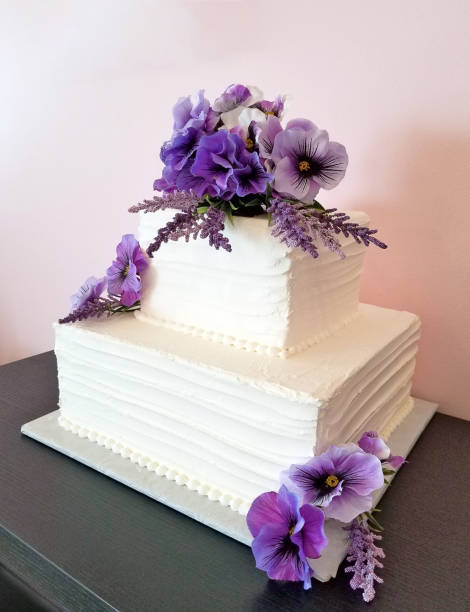 pansy bouquet on tiered square cake