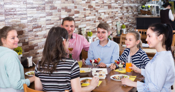 istock Big happy family having fun and dinning 904759930