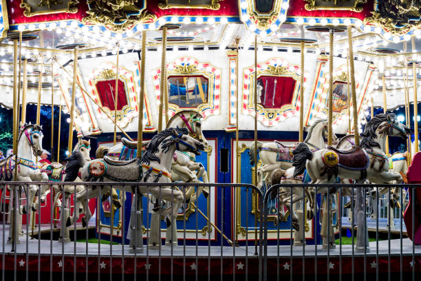 istock Carousal Merry-Go-Round at Night Lit Up 904763916