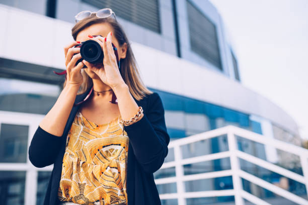 istock Young photographer with a camera on a sunny day 904773614