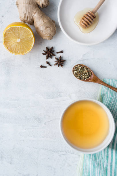 istock Hot herbal ginger tea. Vertical photo. Top view. 904776346
