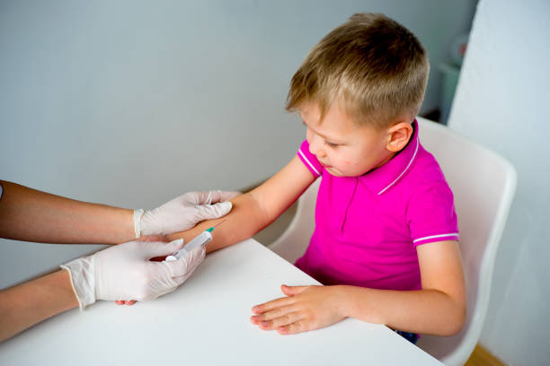 istock Doctor vaccinating a kid 904780326
