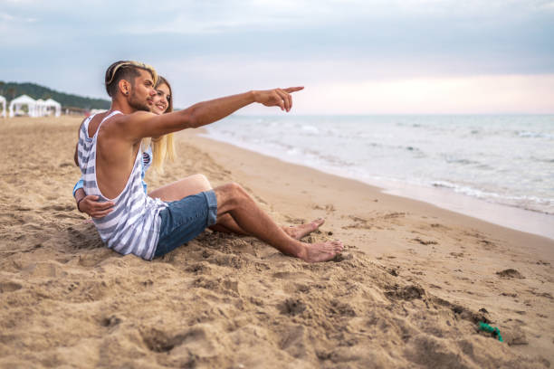 istock Beautiful couple having fun at the beach 904784524