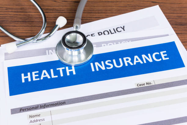 istock health insurance form with stethoscope in top view 904790900
