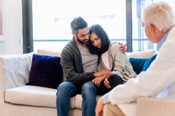 istock Doctor looking at man consoling worried patient 904793186