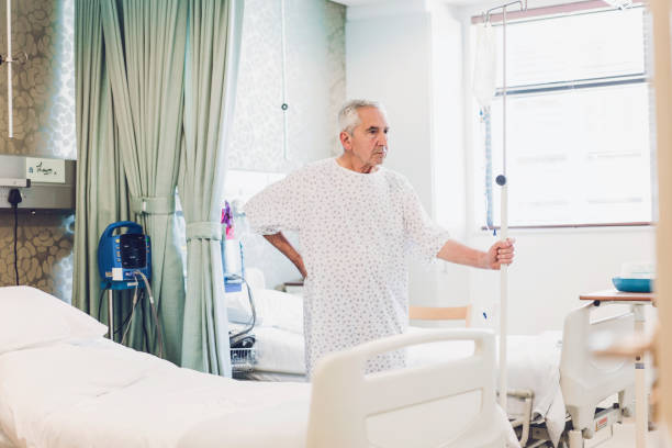 istock Thoughtful senior patient holding iv drip in ward 904793542
