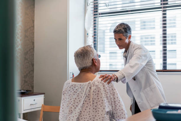istock Confident doctor consoling senior patient in ward 904793882