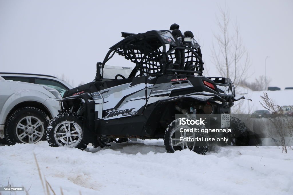 Races on off-road cars and quad bikes over rough terrain in winter. KAZAN, RUSSIA - DECEMBER 23, 2017: Opening of the Winter Season in the Kazan Ring Canyon - Free open auto show - winter carting on the snow track 4x4 Stock Photo Races on off-road cars and quad bikes over rough terrain in winter. KAZAN, RUSSIA - DECEMBER 23, 2017: Opening of the Winter Season in the Kazan Ring Canyon - Free open auto show - winter carting on the snow track 4x4 Stock Photo