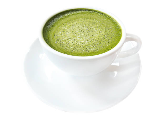 istock Hot green tea matcha latte cup with white saucer isolated on white background, clipping path included. 904798722