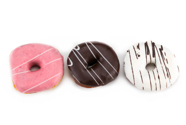 istock Delicious colorful donuts isolated on white background 904801064